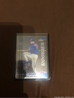 Front of Roy Halladay rookie baseball card showing pitching image and Topps Finest branding with shiny foil finish and protective covering.