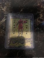 Front photo of Scottie Barnes rookie card showing lottery ticket design with multiple sevens and player image in Raptors jersey