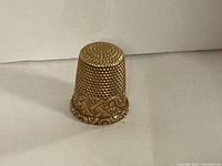 Front view showing dimpled top and decorative base