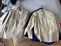 Beige double-breasted linen blazer on left, cream button-up shirt on right with navy shirt underneath