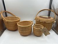 Front view of all four woven baskets grouped together