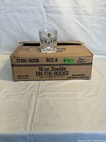 Photo showing one vintage CAPRI lead crystal 10 oz on-the-rocks glass placed on original box.