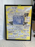 Framed vintage jewelry advertising sign showing original price tags, black and white photos, and print ads on yellow backing.