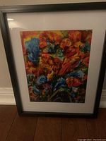 Framed flower painting by Vlad Pronkin showing colorful abstract floral design in red, blue, orange, and green tones