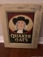 Front view of pop art painting on wood door showing Quaker Oats logo with stylized portrait and signature