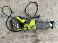 Full view of Ryobi reciprocal saw showing power cord and body condition.
