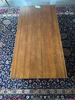 Top view of wooden coffee table showing natural wood grain surface.