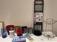 Overview of the miscellaneous household items including glassware, soap dispenser, shoe rack, and fruit basket
