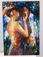Front view of the vibrant, impressionistic oil painting of a couple embracing, signed by Leonid Afremov.