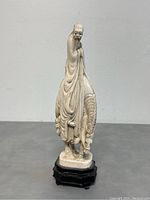 Front side view of the vintage resin figurine showing the elderly man robed and seated on a horse with detailed carved folds and horse mane.