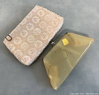 Photo showing both vintage clutches side by side on a gray surface, highlighting size and overall look