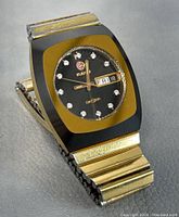 Angled view of watch showing bezel, dial and bracelet.