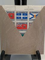 Front view of one sealed sheet showing the 17-cent Canada Day 1979 stamps depicting Canadian provincial flags.