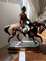 Full view of the Wellington figurine on its wooden base