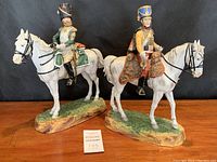 Front view of both figurines side by side