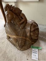 Large stone sculpture showing Native American male figure, horse with flowing mane and a feather detail on the base, size approx 15 x 15 inches.