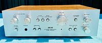 Front view of Akai AM-2200 stereo amplifier showing all control knobs and switches.