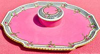 Close-up top view of pink Aynsley vanity tray showing art deco border and rose detailing