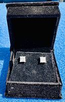 Pair of square cubic zirconia stud earrings in a black velvet clamshell box, showing stone size and setting.
