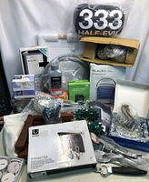 Lot showing multiple home decor, housewares, and small appliances items, including boxed Umbra Magnetter, desktop AC unit, and other various accessories.