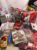Overview of various new party supplies and cards including balloons, hats, and gift bags