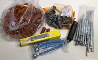 Overview of all pottery tools including ceramic ribs, loop tools, metal shaping tools, and tools in box