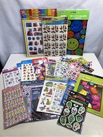 Full view of all sticker sheets included in the lot with various cartoon and animal themes