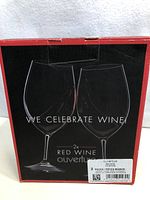 Front of the box showing two red wine glasses illustration and text 'WE CELEBRATE WINE! 2x Red Wine Ouverture'