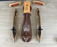Pair of wooden loom shuttles wall sconces mounted on wood panel with storm glass barometer and thermometer / hygrometer above