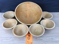 All seven bowls shown together including one large serving bowl and six smaller individual bowls