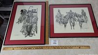 Overview of both framed First Nation people art prints side by side with measuring rulers