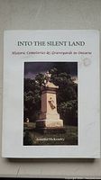 Front cover of 'INTO THE SILENT LAND' by Jennifer McKendry, showing a cemetery monument photo and book title.