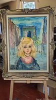 Full view of framed oil painting depicting a blond girl in front of an archway outdoors.