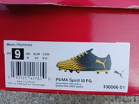 Close-up photo of label on shoe box showing size US 9 and Puma Spirit III FG model in black and ultra yellow color