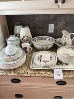 Overview of Portmeirion Botanic Garden dinnerware and serving pieces on countertop