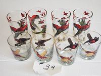 Front view of 8 glasses with pheasant and bird designs arranged in two rows