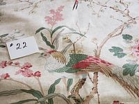 Close-up of bird motif and surrounding floral branches