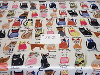 Photo showing multiple illustrated cats with breed names printed on the scarf, colorful and detailed design.