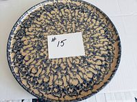 Top view of the circular vintage spongeware pizza platter showing full patterned surface.