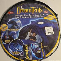 Front of the Dream Tents package showing the space adventure design, features like bonus reading light, perfect reading nook and private space. Packaging shows a child inside the tent on a bed.