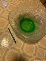 Top-side view of large crystal bowl showing green base and textured clear crystal sides