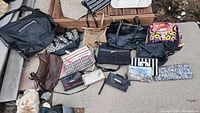 Wide shot of all purses displayed on ground showing various styles and patterns