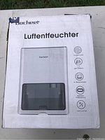 Photo of the Tosheet Luftentfeuchter (Dehumidifier) box front showing product image and key features.