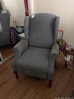 Front view of the Lane manual recliner showing the diamond pattern fabric and wooden legs