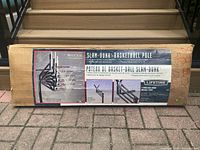 Photo of boxed Lifetime Slam-Dunk basketball pole showing product details and illustrations.