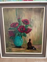 Full view of original painting framed without glass showing red flowers in blue vase and Buddha statue