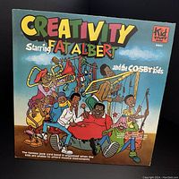 Front cover of the vinyl record sleeve showing colorful cartoon of Fat Albert and the Cosby Kids playing instruments with the word Creativity in large multi-colored letters.
