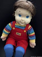 Front view of the vintage 1985 My Buddy doll sitting showing full outfit and facial features.