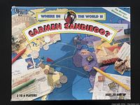 Top down photo of the main cardboard box featuring the world map and Carmen Sandiego title.