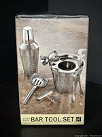 Photo of box front showing the 7 piece bar tool set and the brand NT